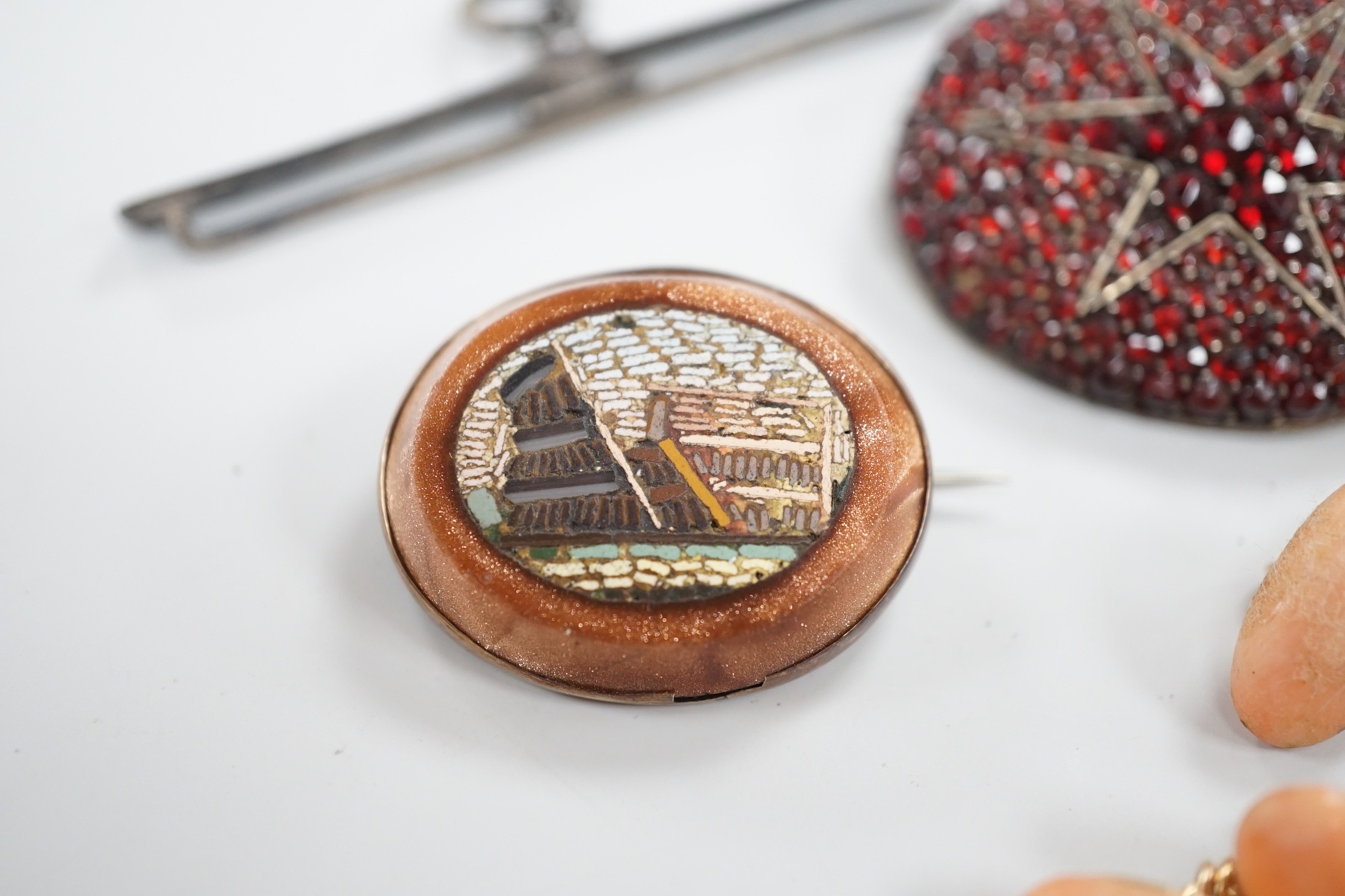 A pair of yellow metal and coral set cufflinks, coral 16mm and three assorted brooches including micro mosaic.